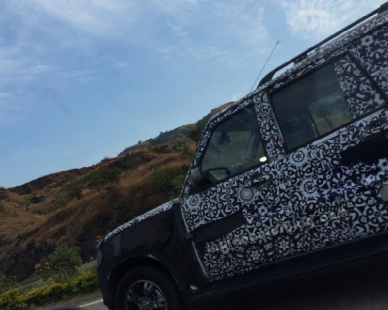 2014-Mahindra-Scorpio-Facelift-spied-IAB-left-side-1024x819.jpg