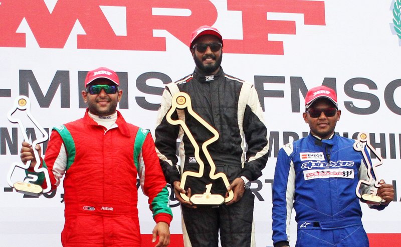 Arjun Narendran (centre) winner of Indian Touring Cars race flanked by second-placed Ashish Rama.JPG