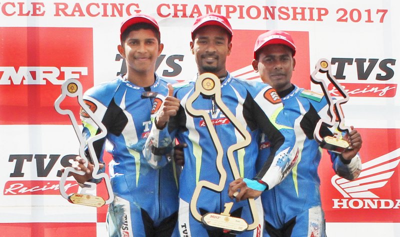 Jagan Kumar (centre), winner of the Super Sport Indian (up to 165cc) class race flanked by secon.JPG