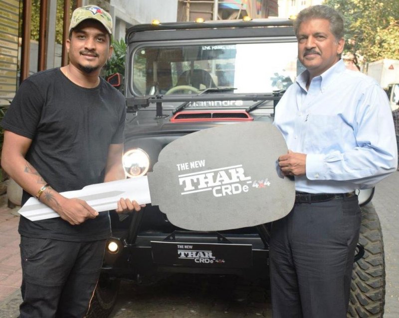 Mr. Anand Mahindra handing over Mahindra Thar to Rapper Divine.jpg