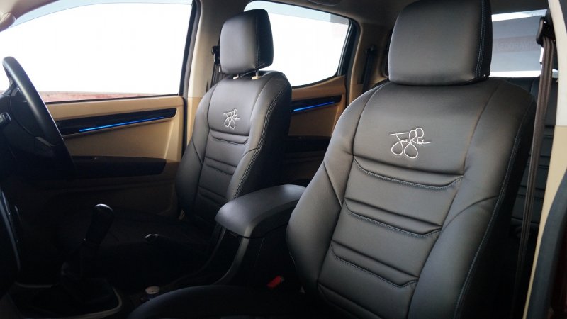 Sporty Black Faux Leather Seat Cover Embroidered with Jonty's Signature.JPG